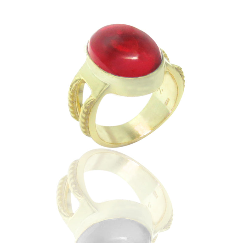 Gold plated ring with oval shaped garnet stone. Gem stone is deep red colour. 